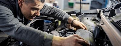 man changing a car battery