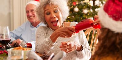 woman pulling christmas cracker