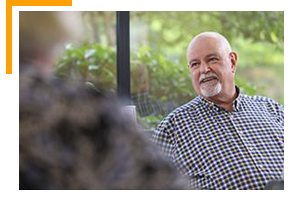 Employee in meeting smiling