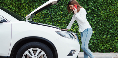 woman with broken down car