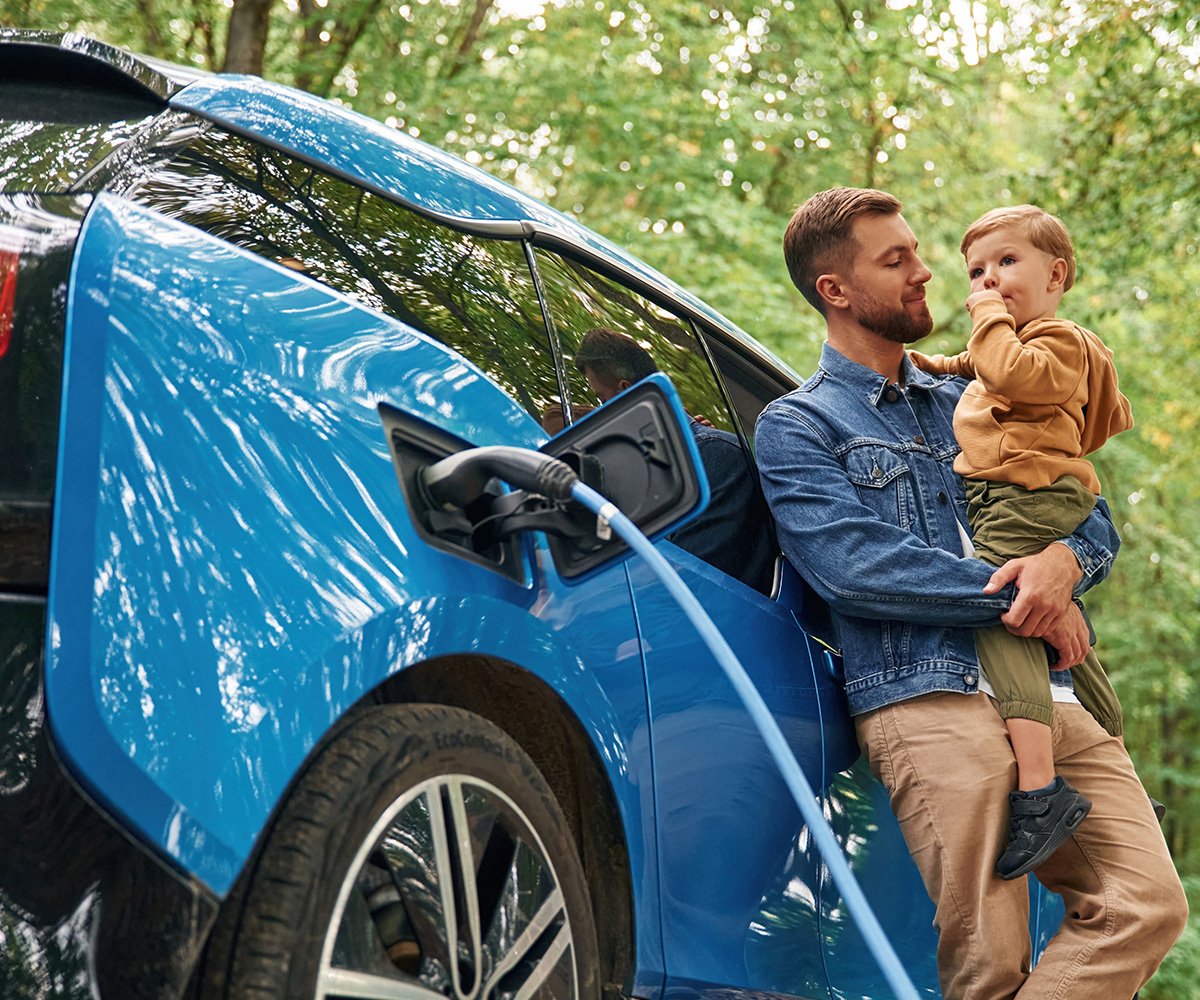 White car in forest with defaqto logo 2025