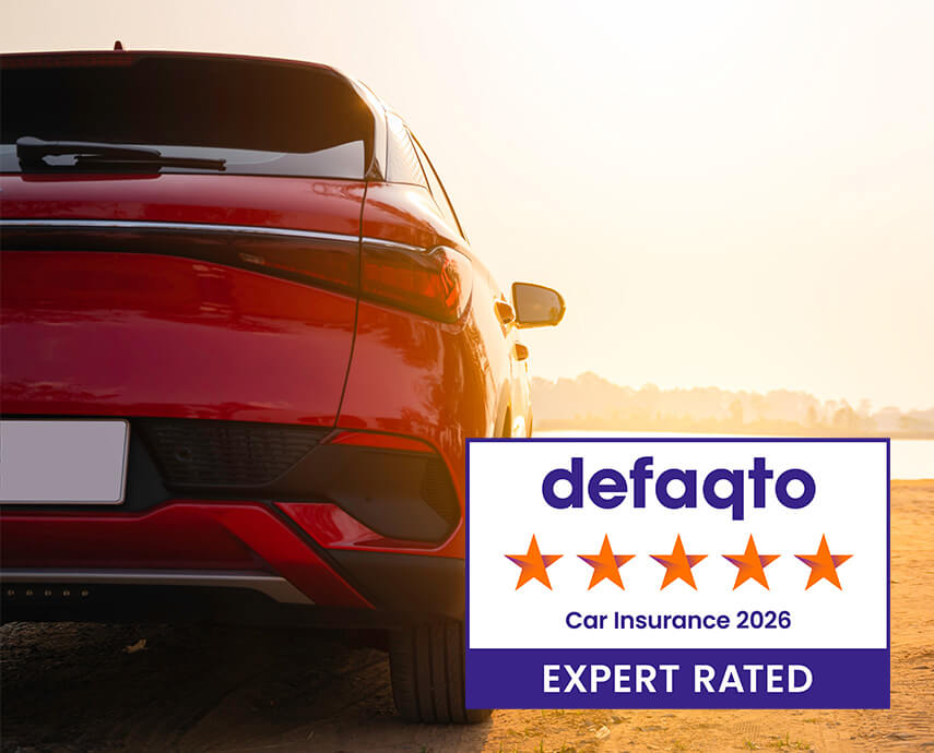 Red car on road with defaqto logo 2026