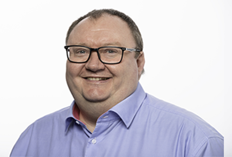 Headshot of Adam Clarke, Chief Underwriting Officer