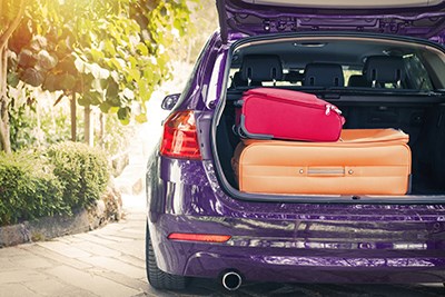 Open car boot full of luggage