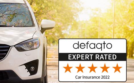 White car in forest with defaqto logo 2022