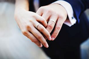 married couple holding hands