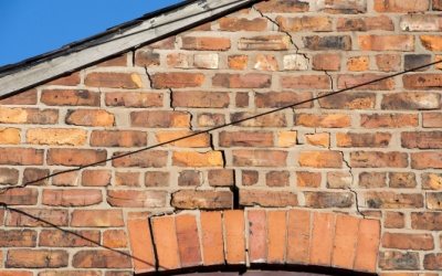 Cracks on exterior red brick wall