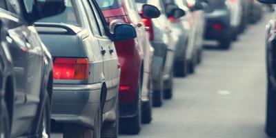 row of cars sat in traffic queue