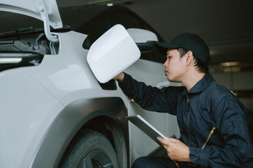 electric car being serviced by a mechanic