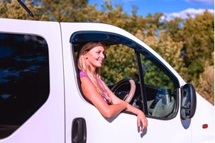 A lady in a white van