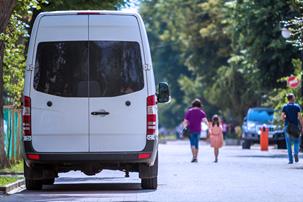 White van parked on a road