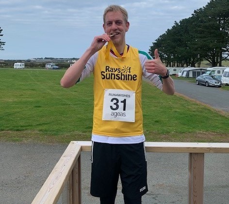 Rays of sunshine runner with medal