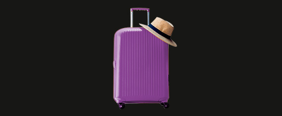 purple suitcase with a hat