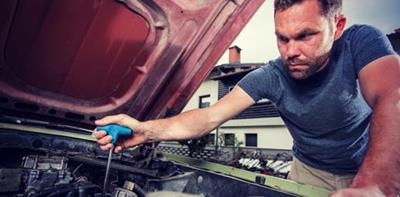 Man repairing his car 