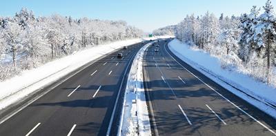cars driving on motorway during winter