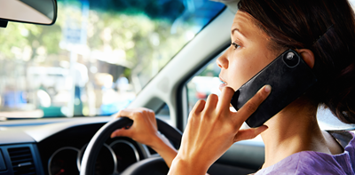 Woman talking on her mobile phone while driving