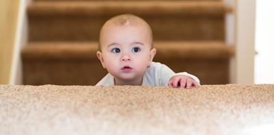 toddler climbing up stairs