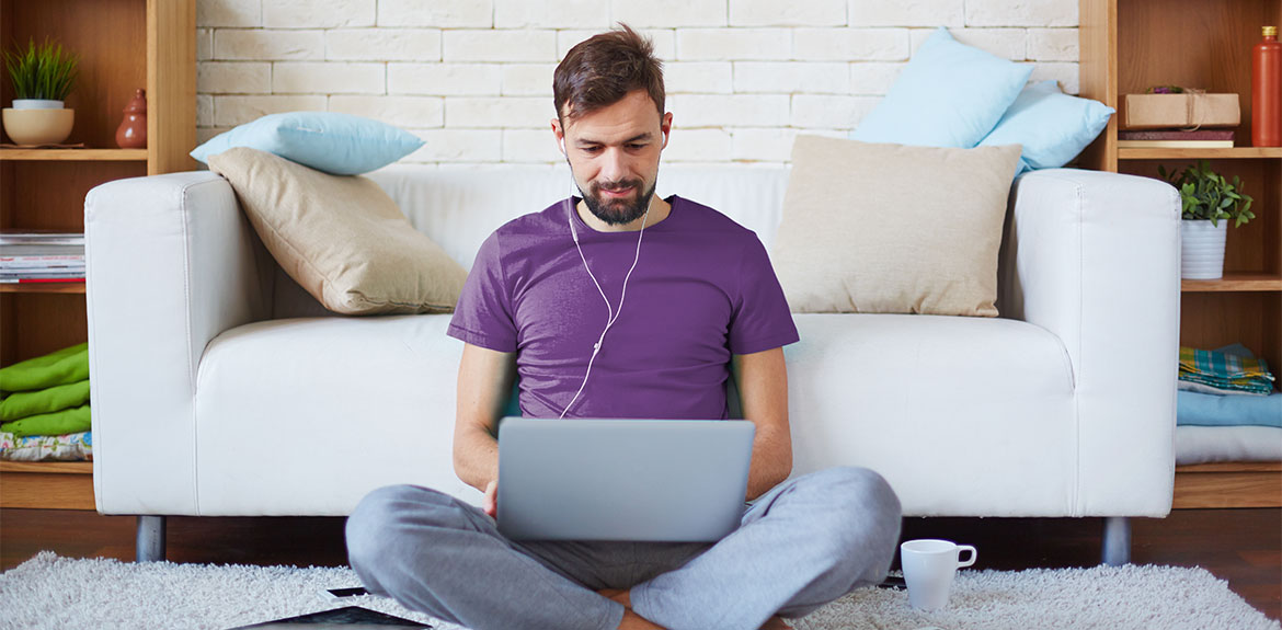 Man using laptop to search for insurance