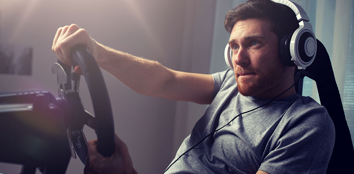 man playing racing video game