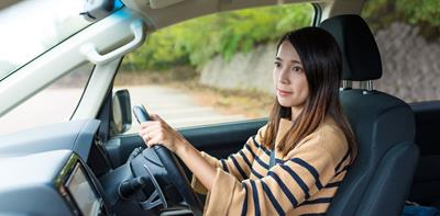 young woman driving car