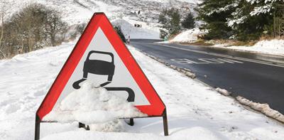 road sign snow winter