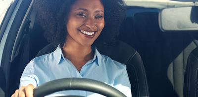 happy smiling woman driving