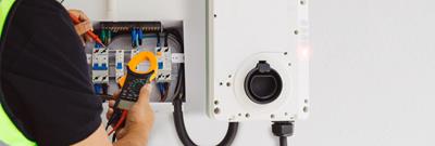 Electric car charger plugged in to car