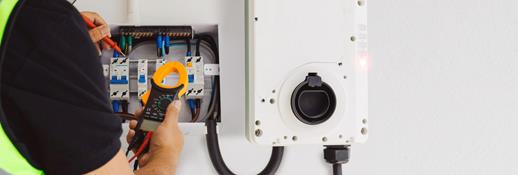 Electric car charger plugged in to car