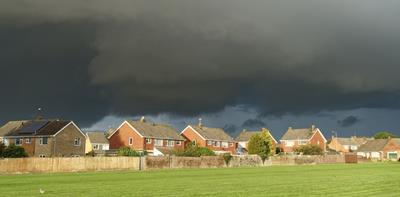 Landscape of houses with storm weather