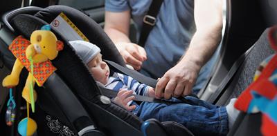 toddler girl in car seat