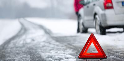 car broken down in winter on snowy road