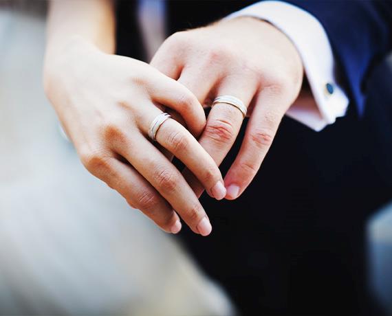 married couple holding hands